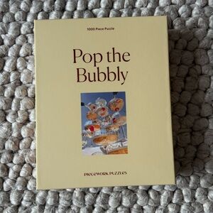 Piecework 1000 piece Puzzle 'Pop the Bubbly'